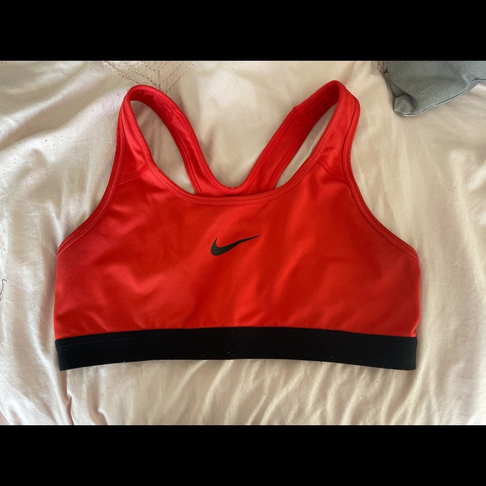 Orange and black Nike sports bra